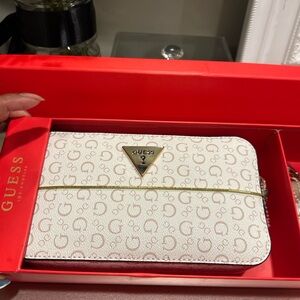 GUESS Cream Signature Monogram crossbody bag with Gold Triangle Logo